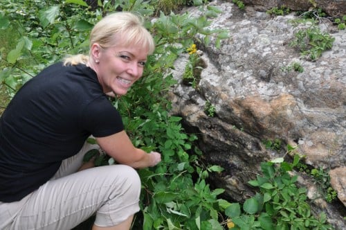 Liisa Karkkainen and her native rock of amethyst crystals in Thunder Bay 