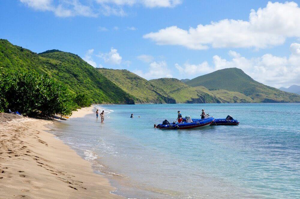 People walking on the beach at Carambola Beach Club Friar's Bay St. Kitt's