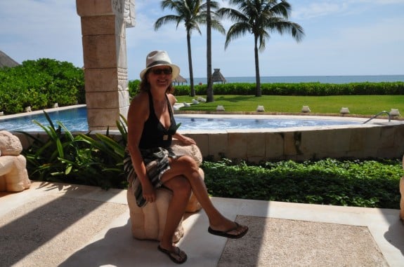 Woman at a swimming pool wearing a sarong. 