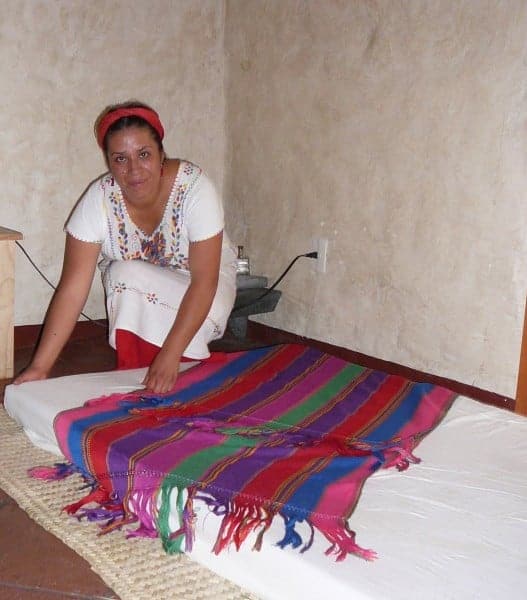 A shaman prepares for a rebozo or shawl massage treatment in Oaxaca Mexico.