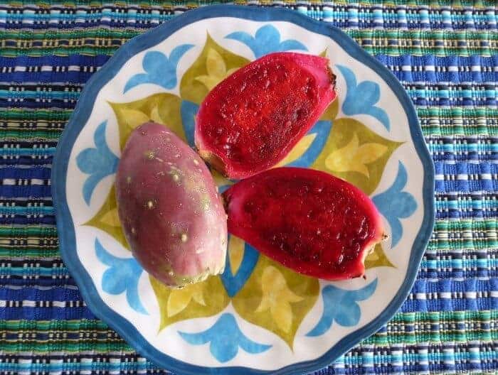 Pink prickly pear fruit on a blue plate in Oaxaca, Mexico. 
