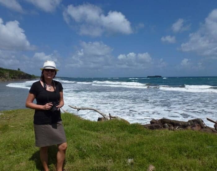 Woman hiking by the ocean in Grenada, Caribbean.