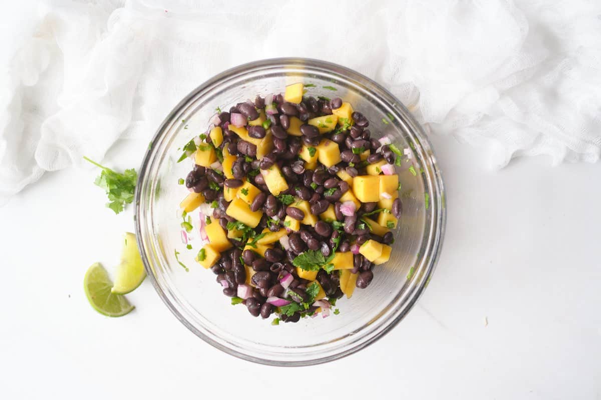 Black bean and mango salad in a mixing bowl.