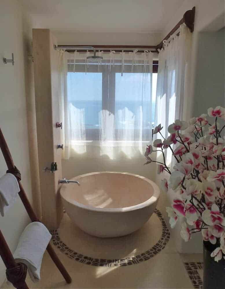 A stylish round bathtub at Zoa resort with an ocean view in Mazunte, Mexico. 