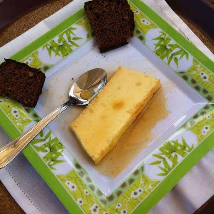 Gingerbread and flan on a green plate at Casa Pan de Miel in Oaxaca Mexico. 