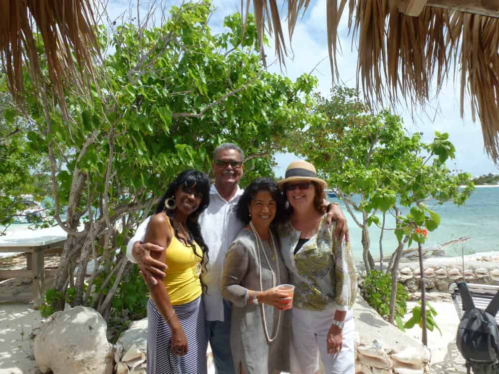 The late Eudoxie Wallace at Scilly Cay with three women. 