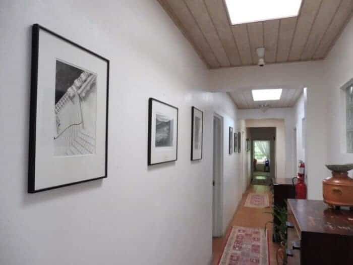 Hallway at Olveston House with photos by Linda McCartney