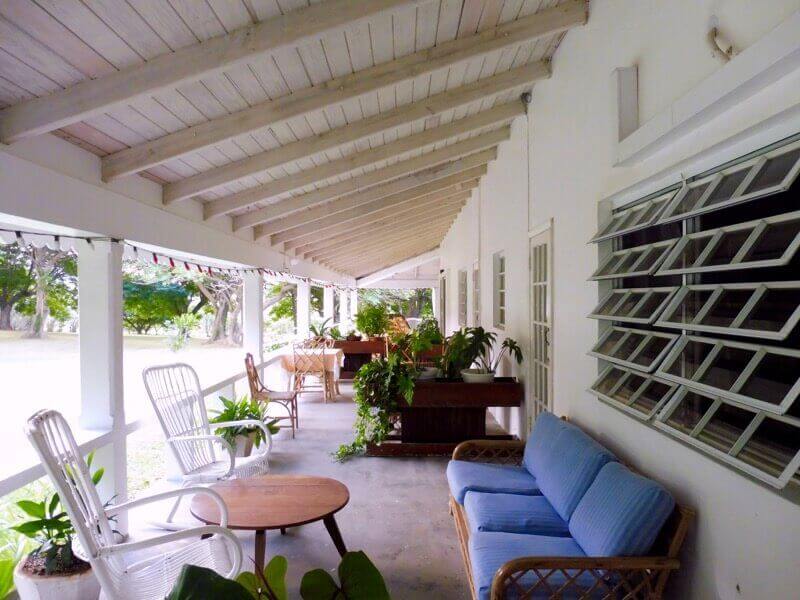 Veranda with easy chairs at Olveston House.