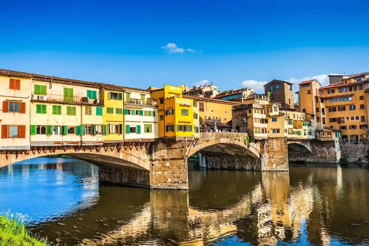 Famous Ponte Vecchio with river Arno at sunset in Florence, Italy.