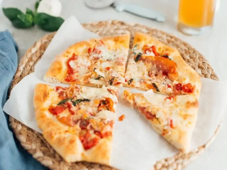 A brie, prosciutto and basil pizza made with beer pizza dough.