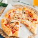 A brie, prosciutto and basil pizza made with beer pizza dough.