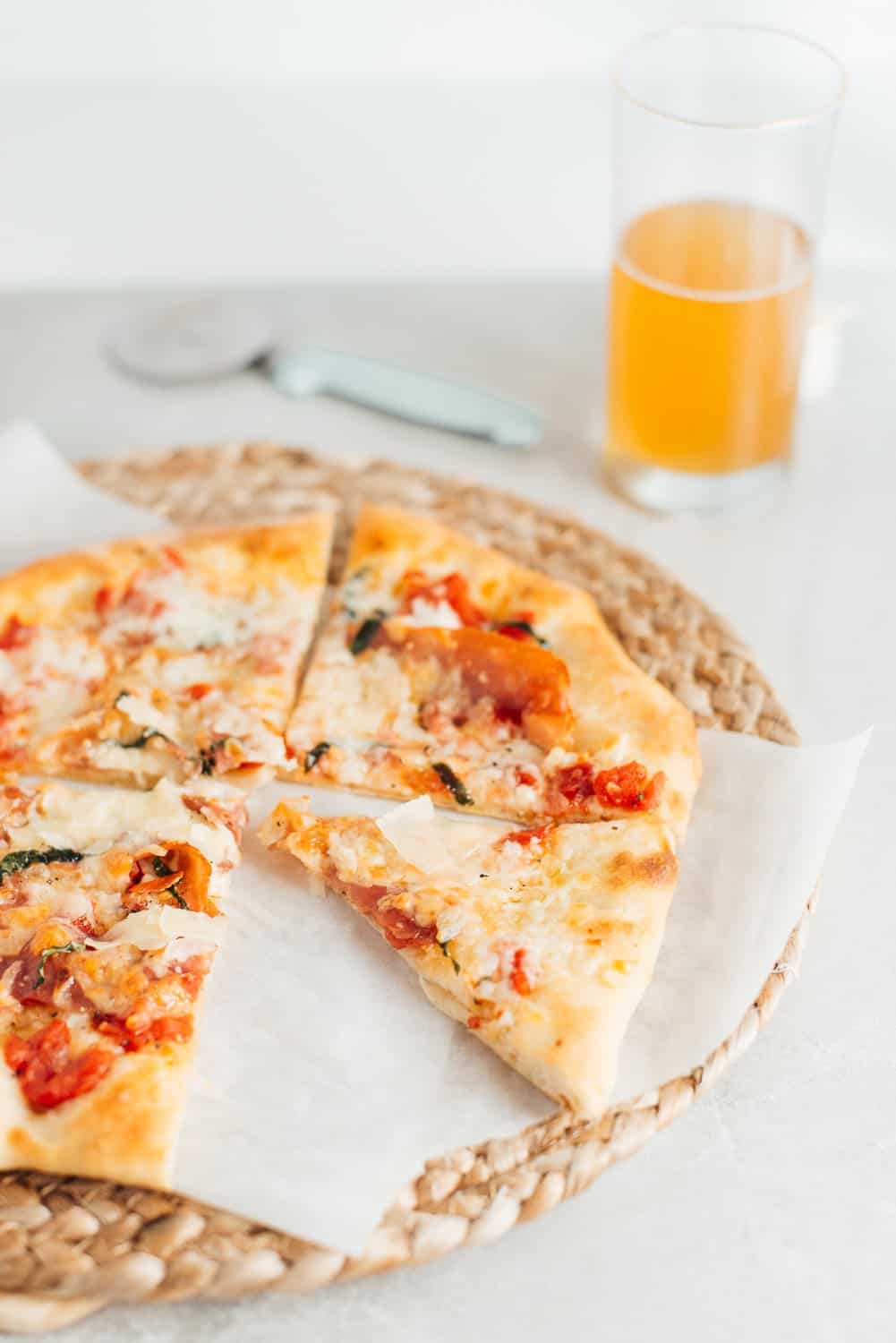 Easy homemade pizza with a glass of beer. 