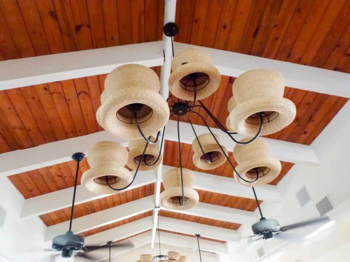 Straw hats on a light fixture as decor at Straw Hat Restaurant on Anguilla.