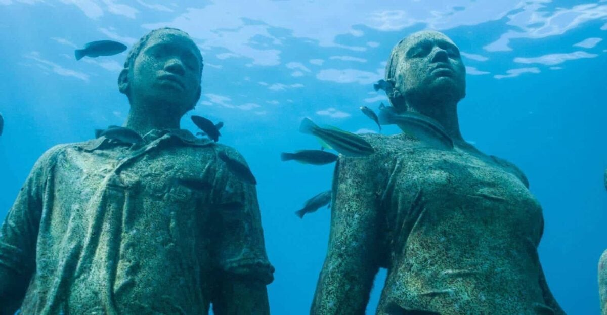 Otherworldy statues at the Grenada Underwater Sculpture Park. Photo Credit: Howard Clarke
