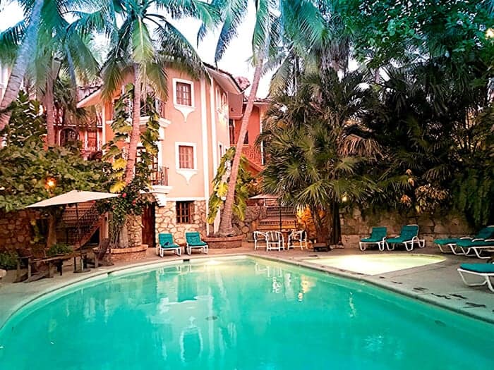 Swimming pool and lush greenery at Santa Fe Hotel in Puerto Escondido Mexico.