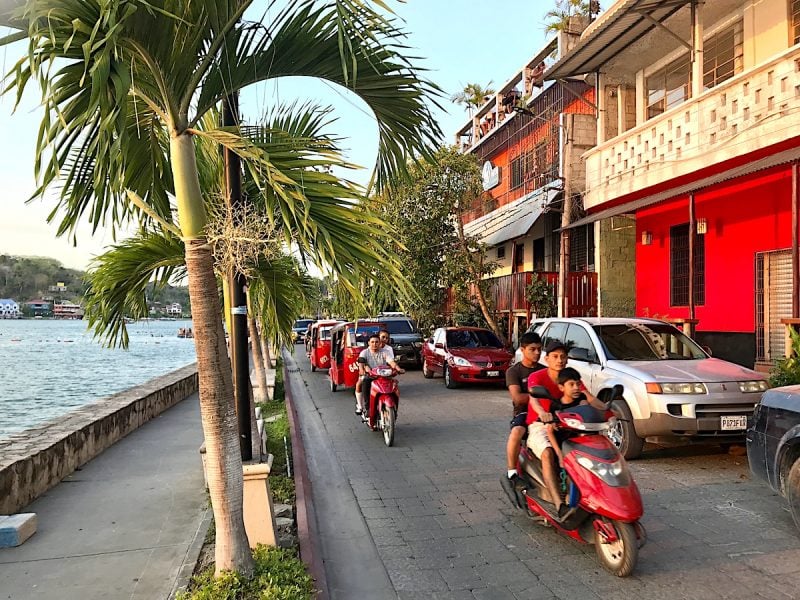 Street scene of tuk tuks in Flores, Guatemala.