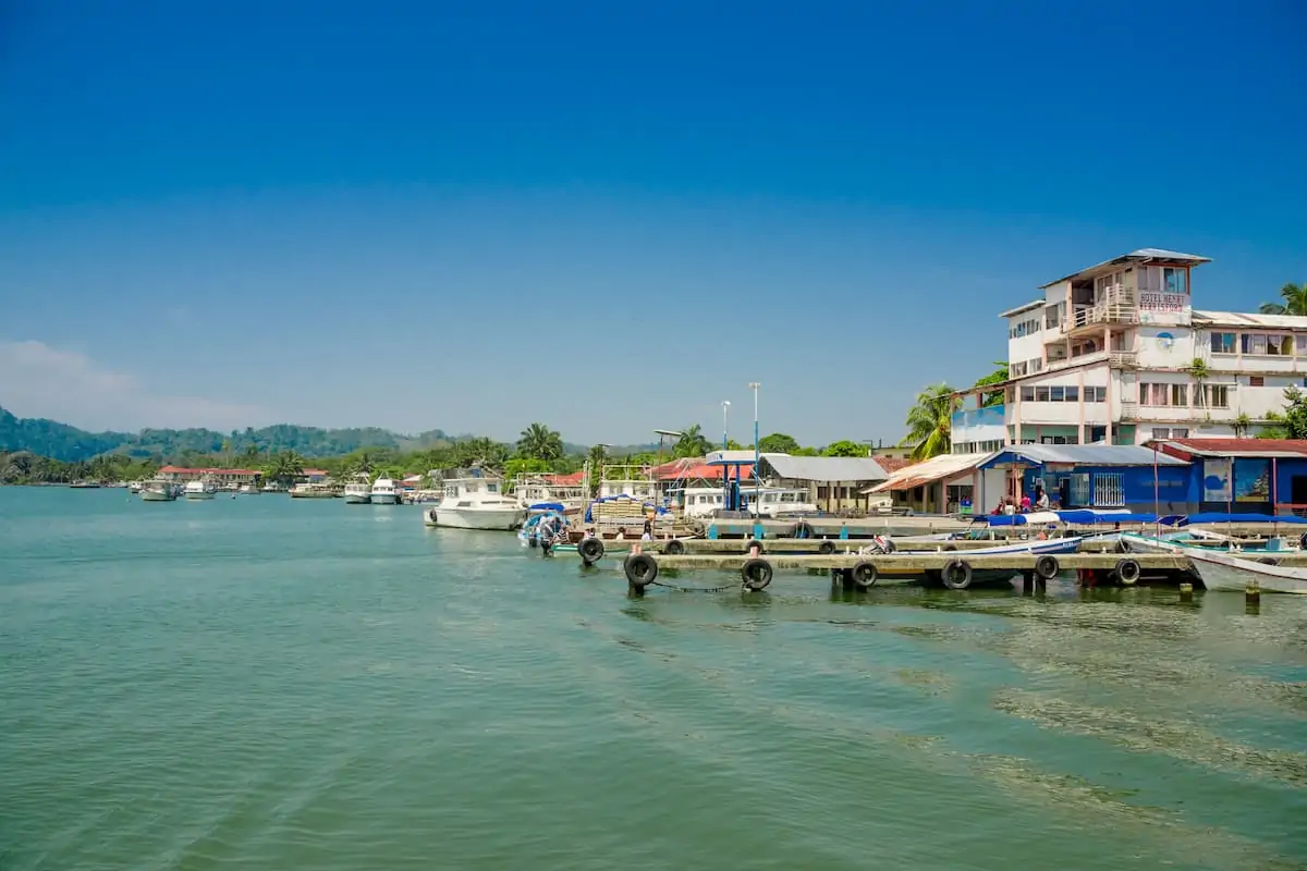View of houses on the water in Livingston, Guatemala.