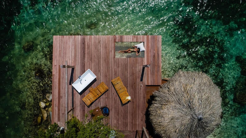 Drone view of a deck and the Caribbean at Isla Alistaire a boutique villa in Aruba. Credit AOV