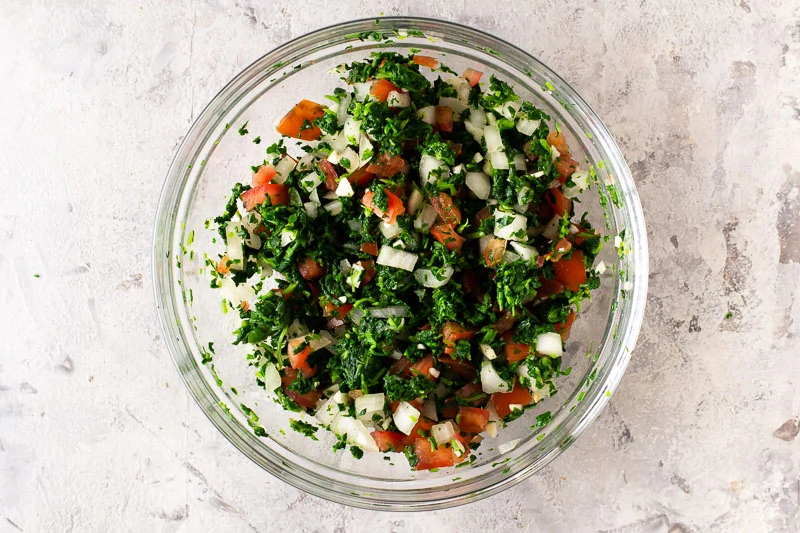 Mix the cooked, cooled and chopped watercress with the tomatoes and onions