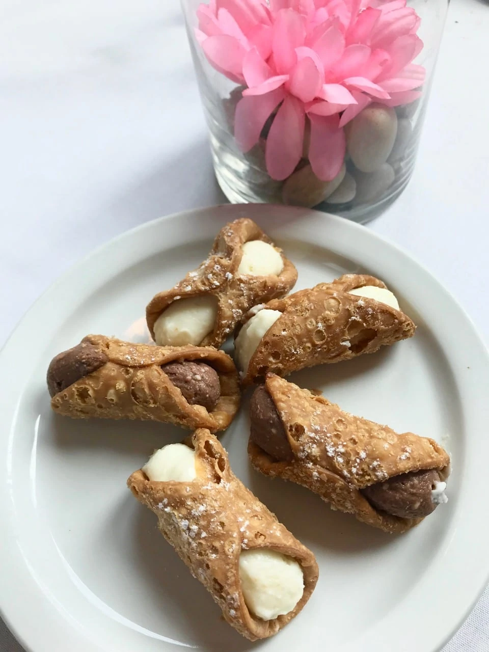 Four cannoli on a white plate served during a Toronto Harbour Brunch Cruise. 