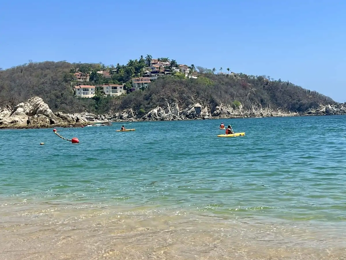 People kayaking in Huatulco on a sunny day..