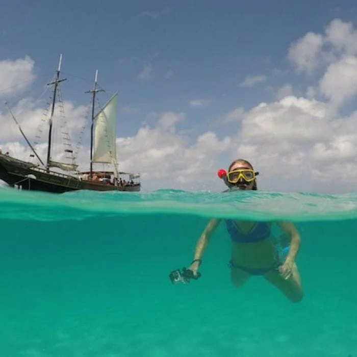 A woman snorkelling in Aruba with Jolly Pirates