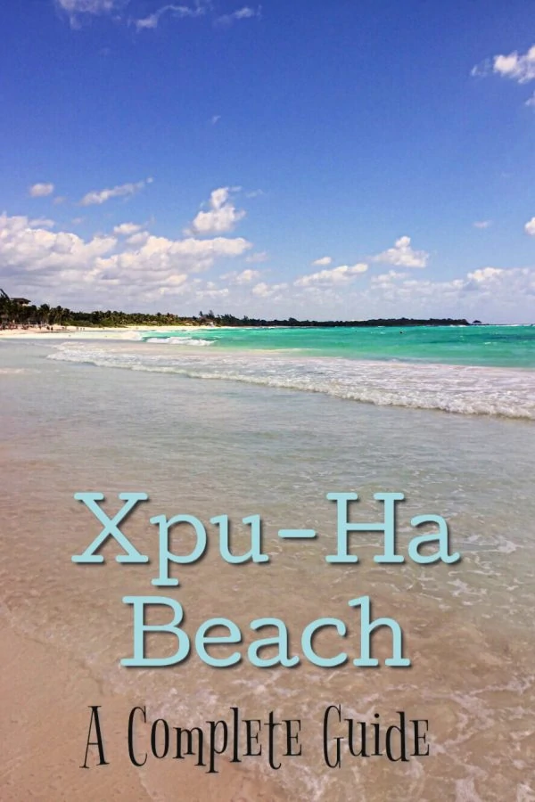 Sand and blue waters with text overlap of Xpu-Ha Beach 