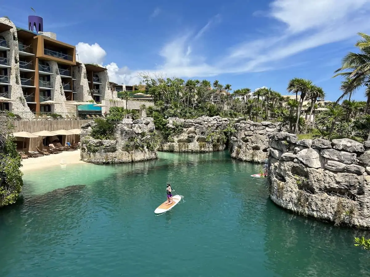 Person paddleboarding at Hotel Xcaret Arte in Mexico. 