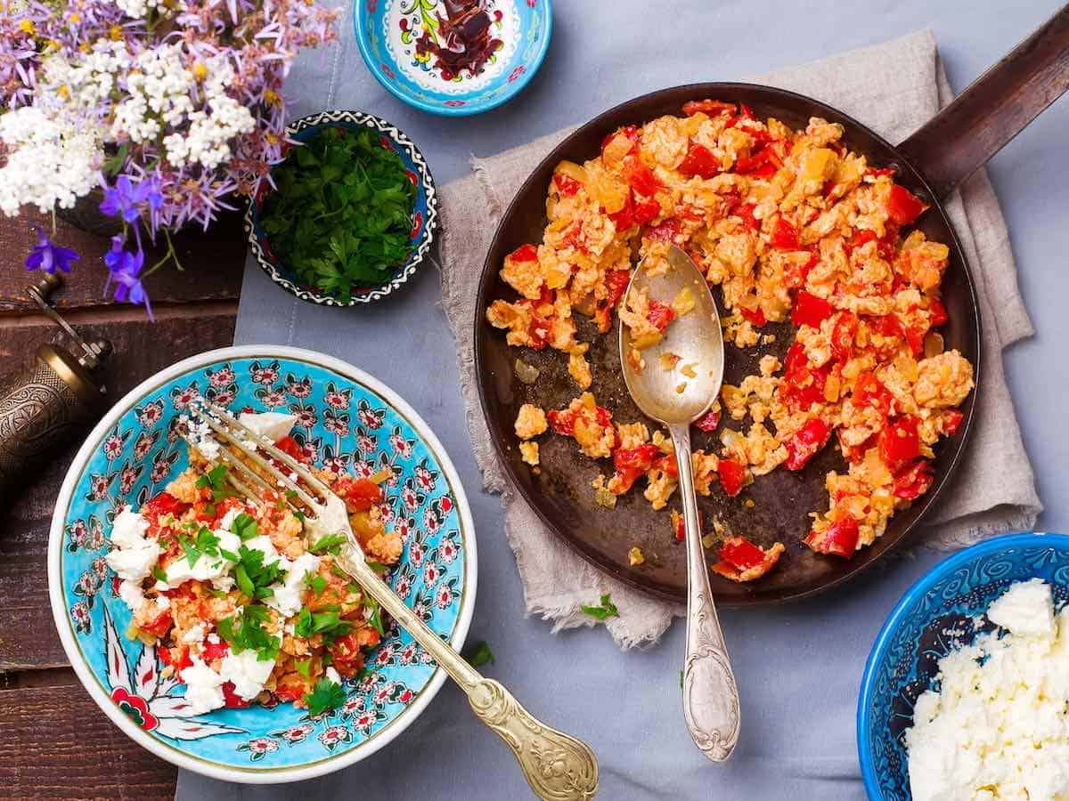 Turkish Scrambled Eggs with Tomatoes and peppers in a serving dish..