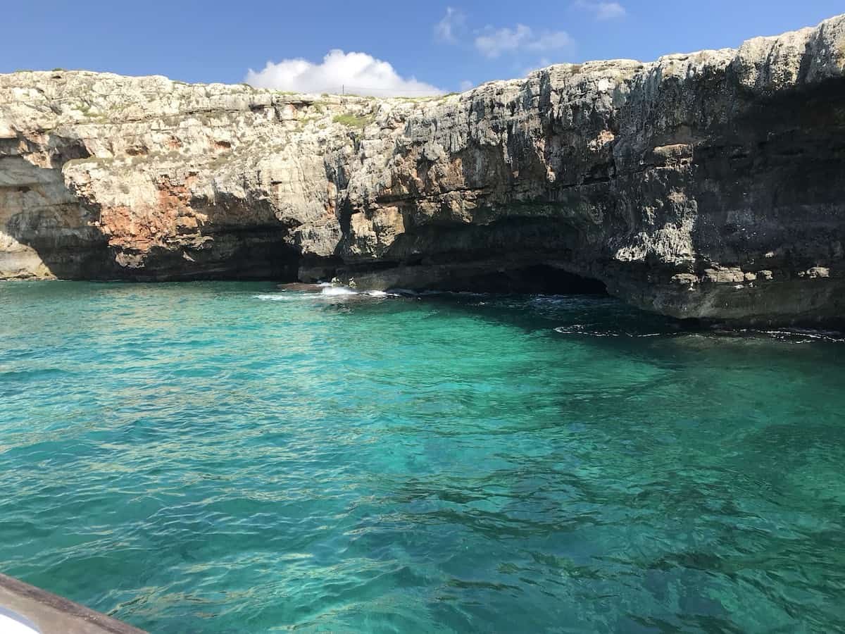 Blue water and sea caves south of Gallipoli near Santa Maria di Leuca in Italy.