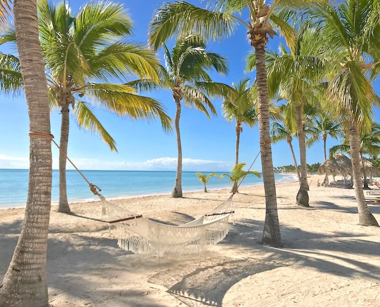 Hammocks at Secrets Cap Cana on Juanillo Beach, a white sand beach. 