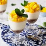 Mango Panna Cotta with a date base in a clear glass.