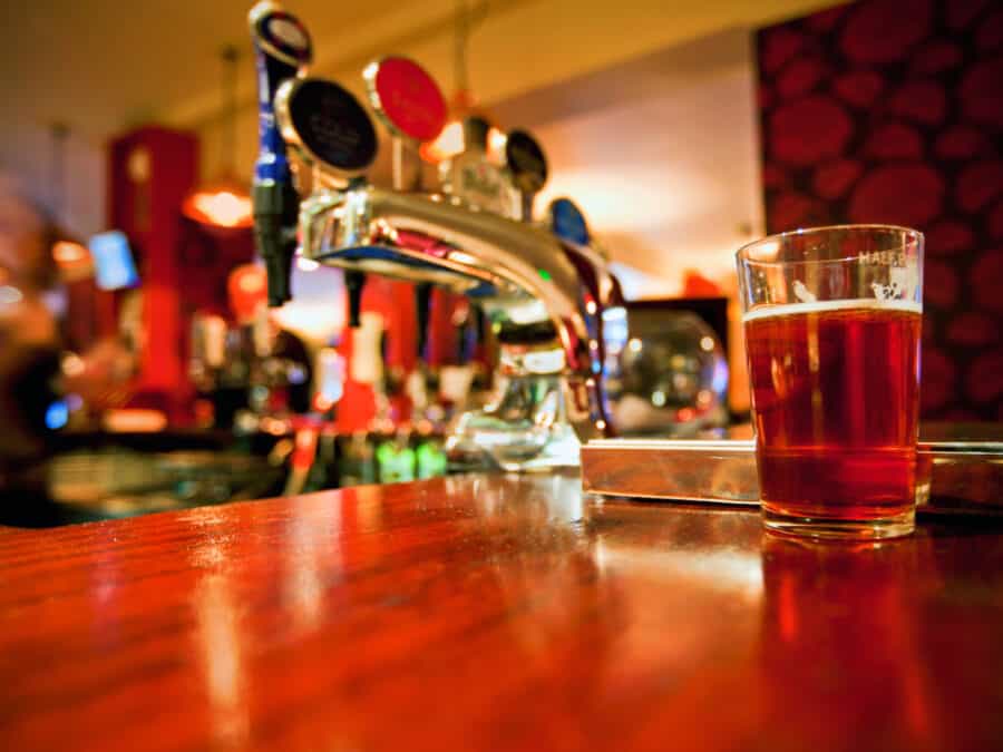 Pint of beer on a bar in a London pub.
