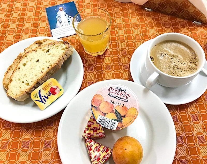 Bread, jams, coffee and juice at breakfast at Casa Maria Immacolata.