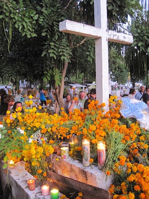 Marigolds and candles at a cemetery on Day of the Dead in Puerto Escondido, Mexico. 