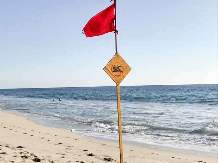 Red flag on beach in Puerto Escondido, Mexico. Safety - Beaches
