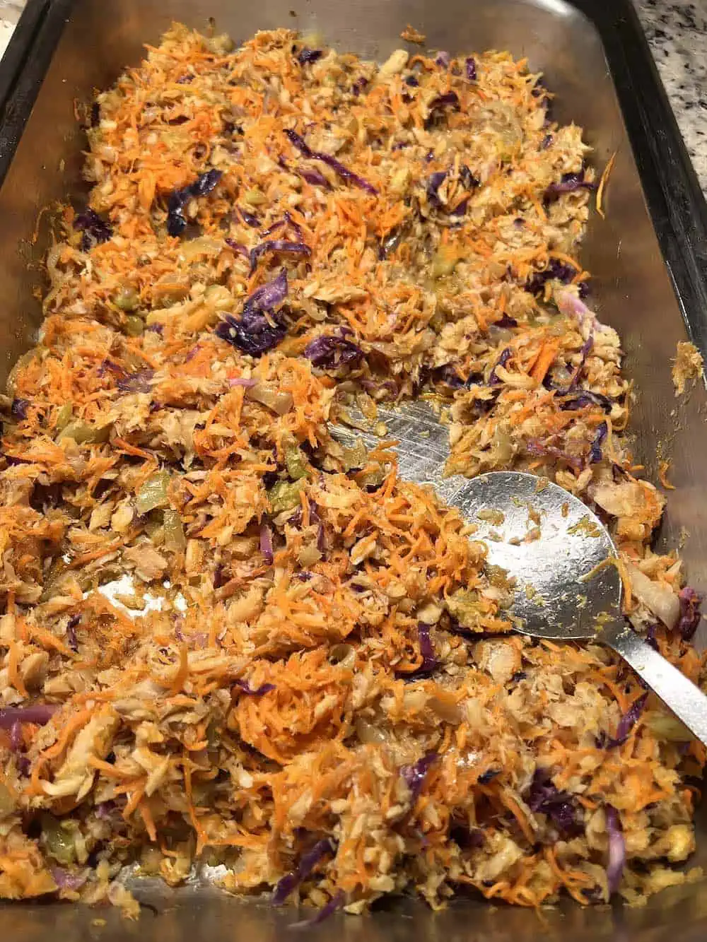 A large serving dish of Grenadian saltfish souse.