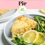 Tinned salmon pie on a plate with green beans and Pinterest text overlay.
