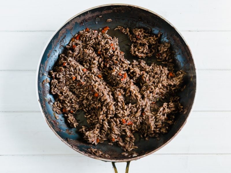 Cooked black beans and rice in a pan 