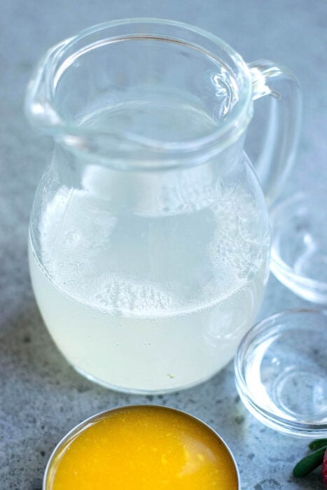 lemon juice, agave syrup and sparkling water in a pitcher