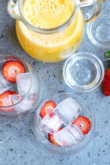 Ice and strawberries in a cup