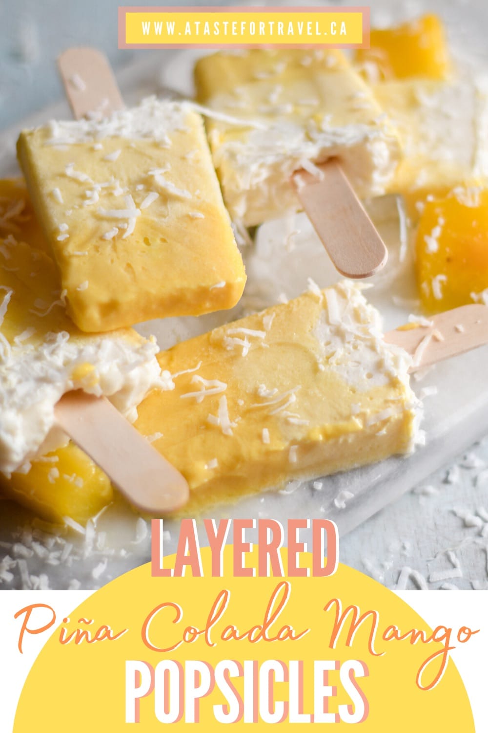 Mango coconut popsicles on a white table. 