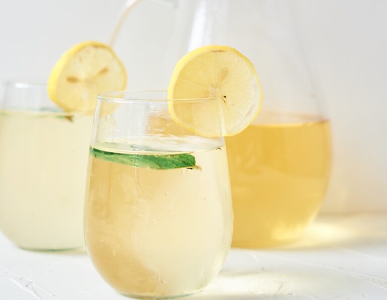 fresh chamomile iced tea garnished with lemon and mint