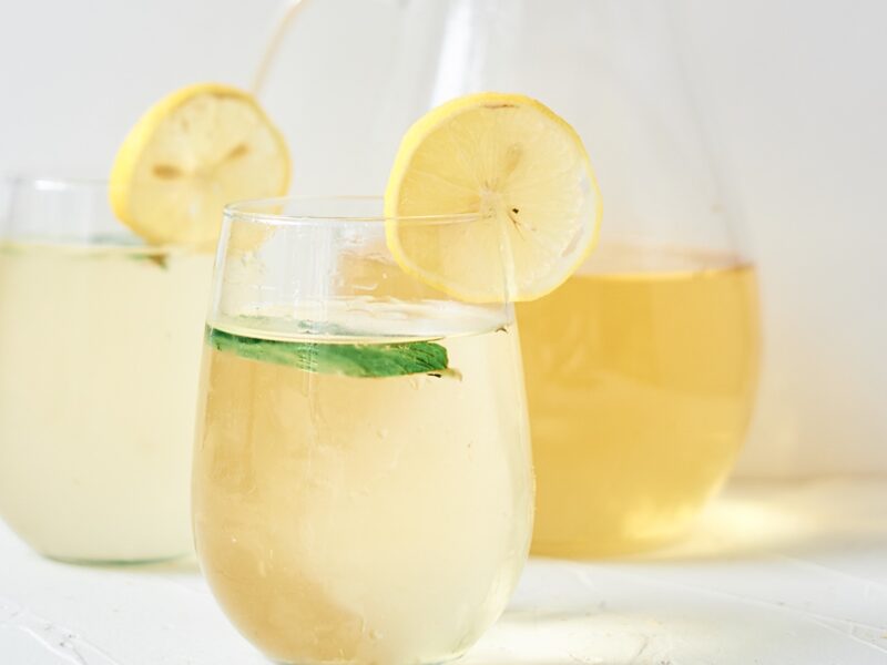 fresh chamomile iced tea garnished with lemon and mint