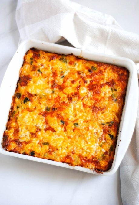 Freshly baked Spanish breakfast casserole in a white baking dish.