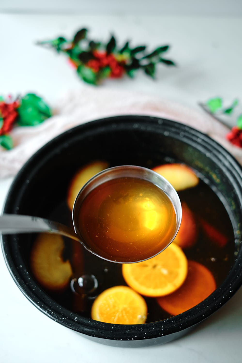 Ladle of spiced holiday tea.