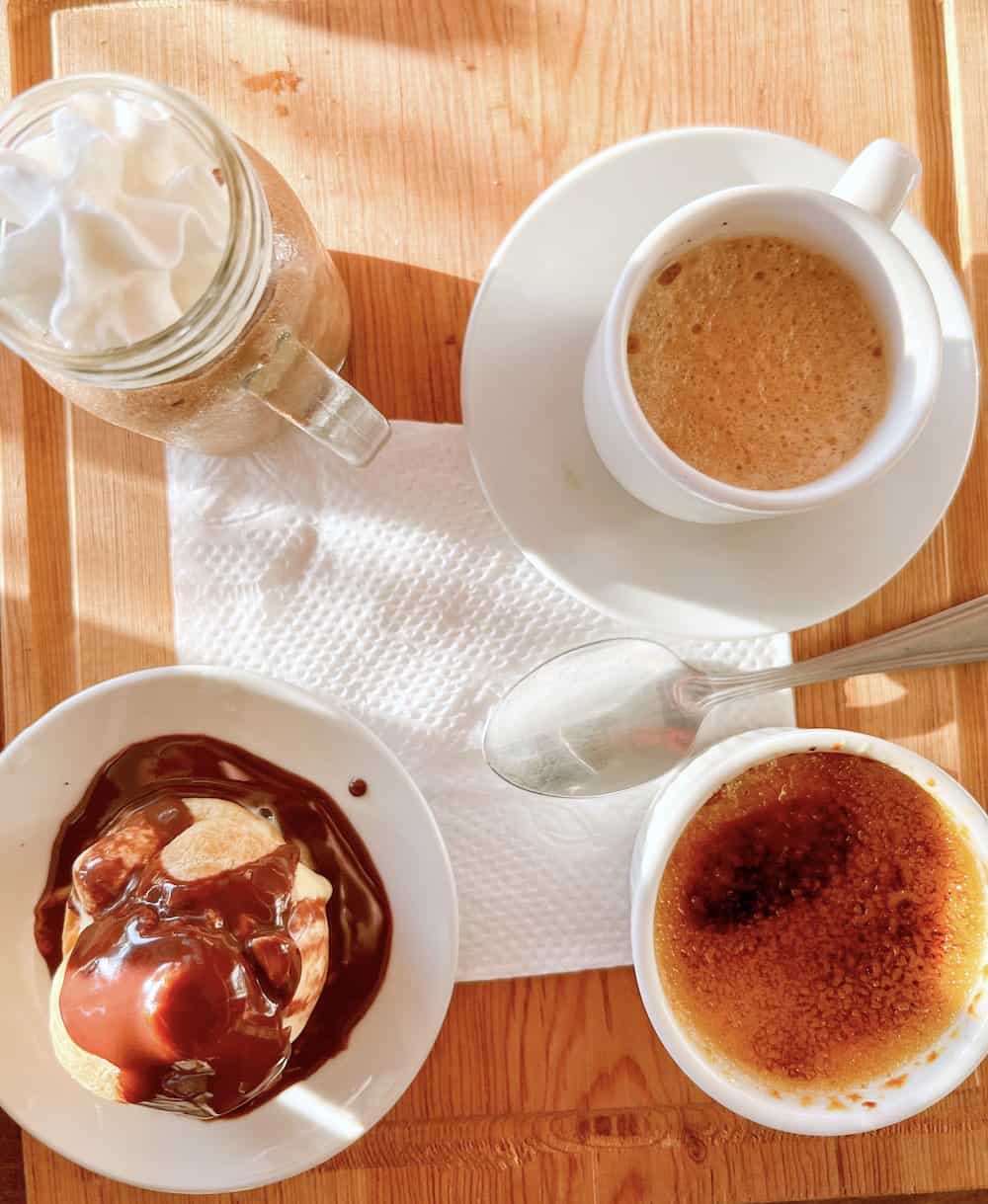 Mousse de chocolate, the profiteroles or the crème brûlée on a table..