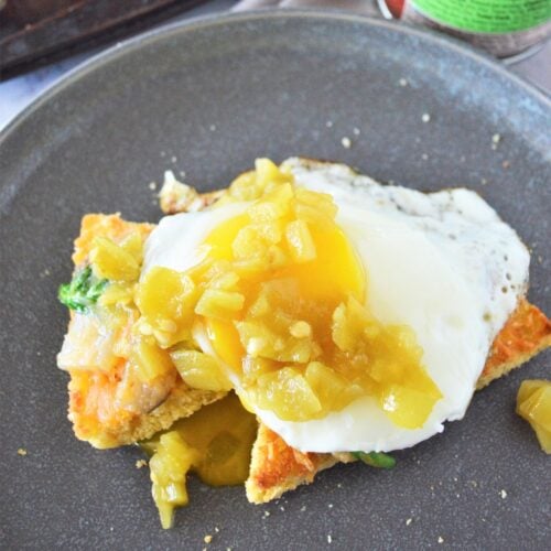 Green chile eggs on leftover cornbread.