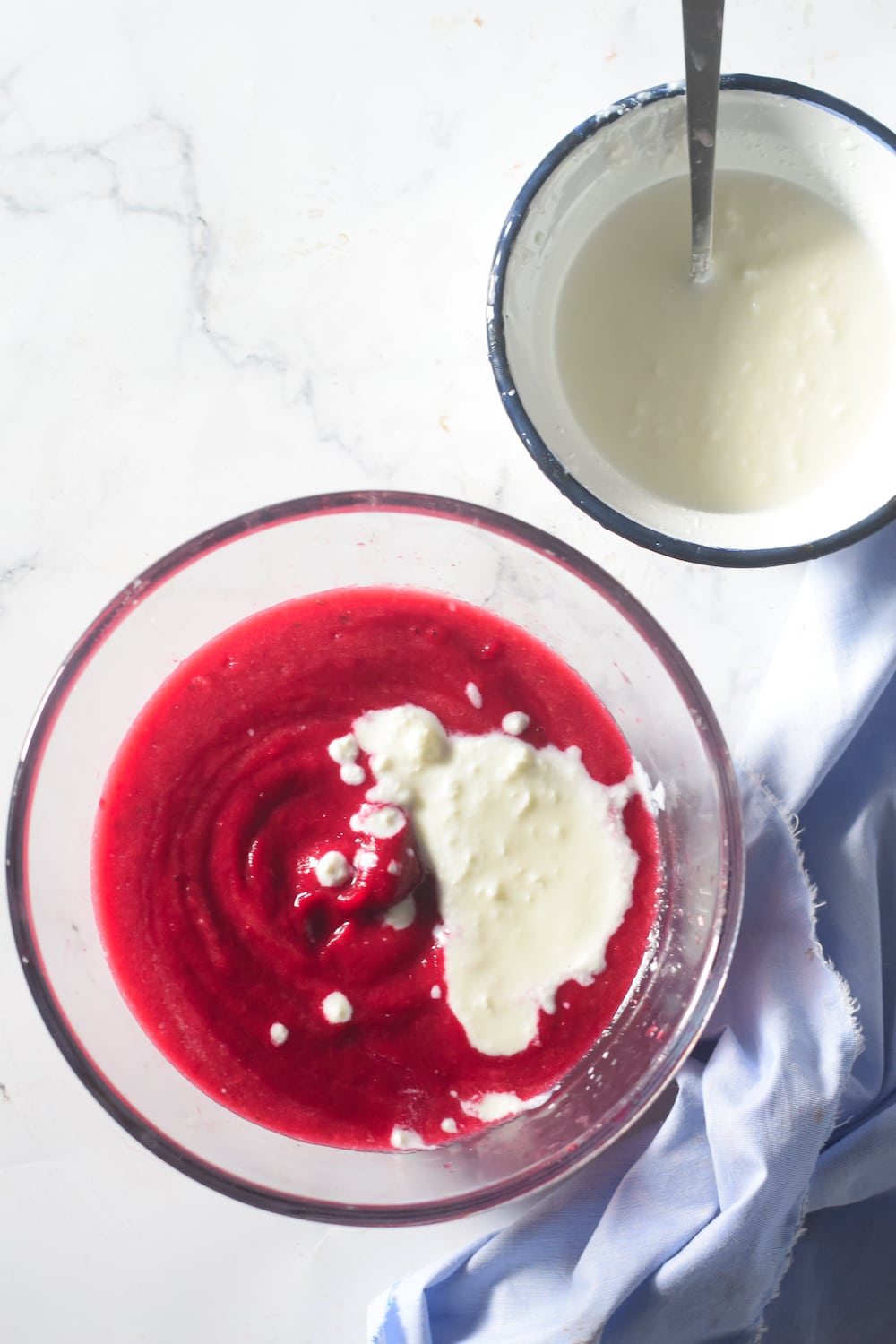 Adding yogurt to beet puree for cold beet soup. 