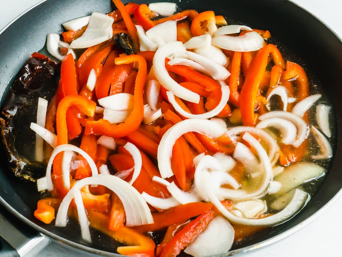 Vegetables and chili guaque simmering in a pan. 